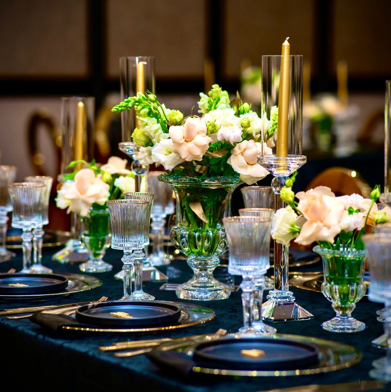 Elegant wedding reception with crystal chandeliers and romantic candlelight